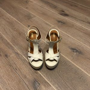 White strapped platforms